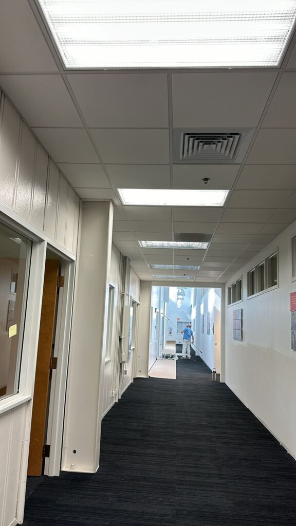 Team photo of employees smiling, representing our 'About Us' story